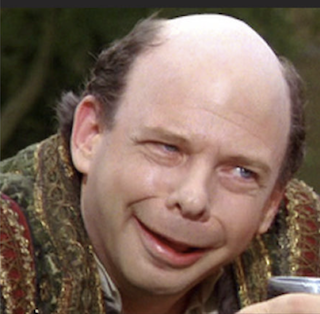 A picture of Wallace Shawn in The Princess Bride where it's kinda hard to see his teeth.